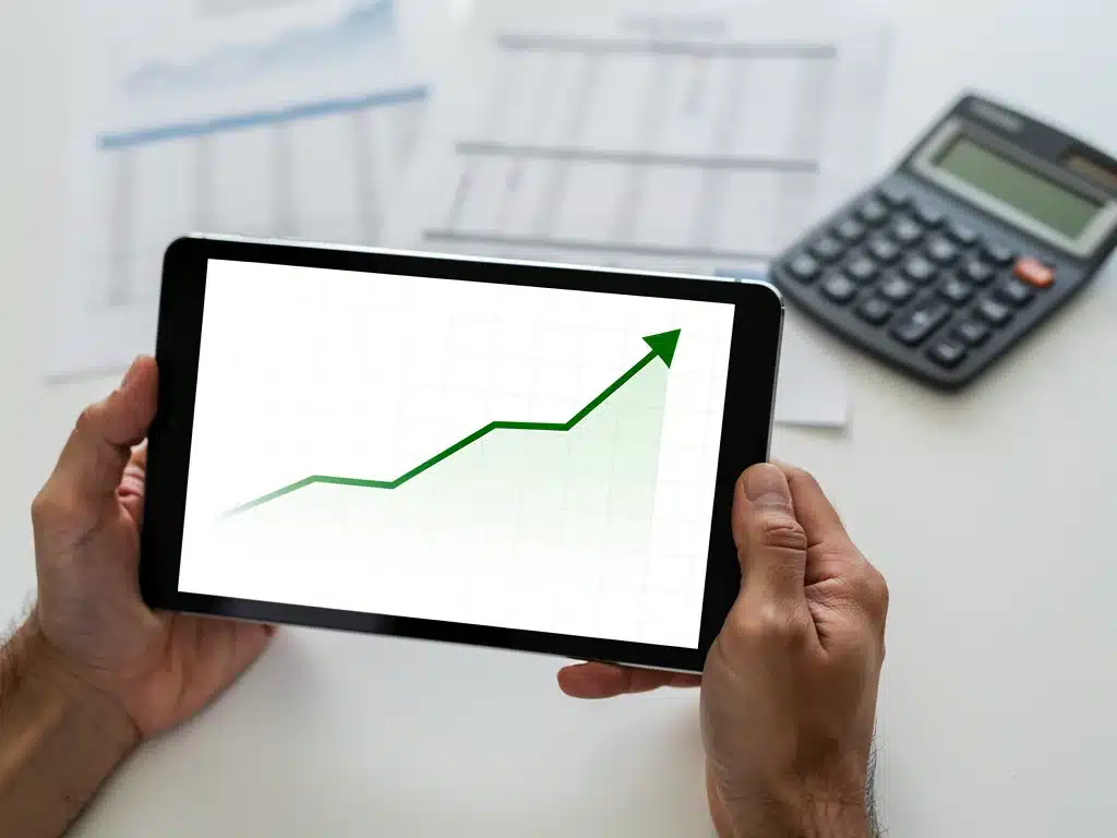 Financial growth chart on tablet, symbolizing stable annuity returns.